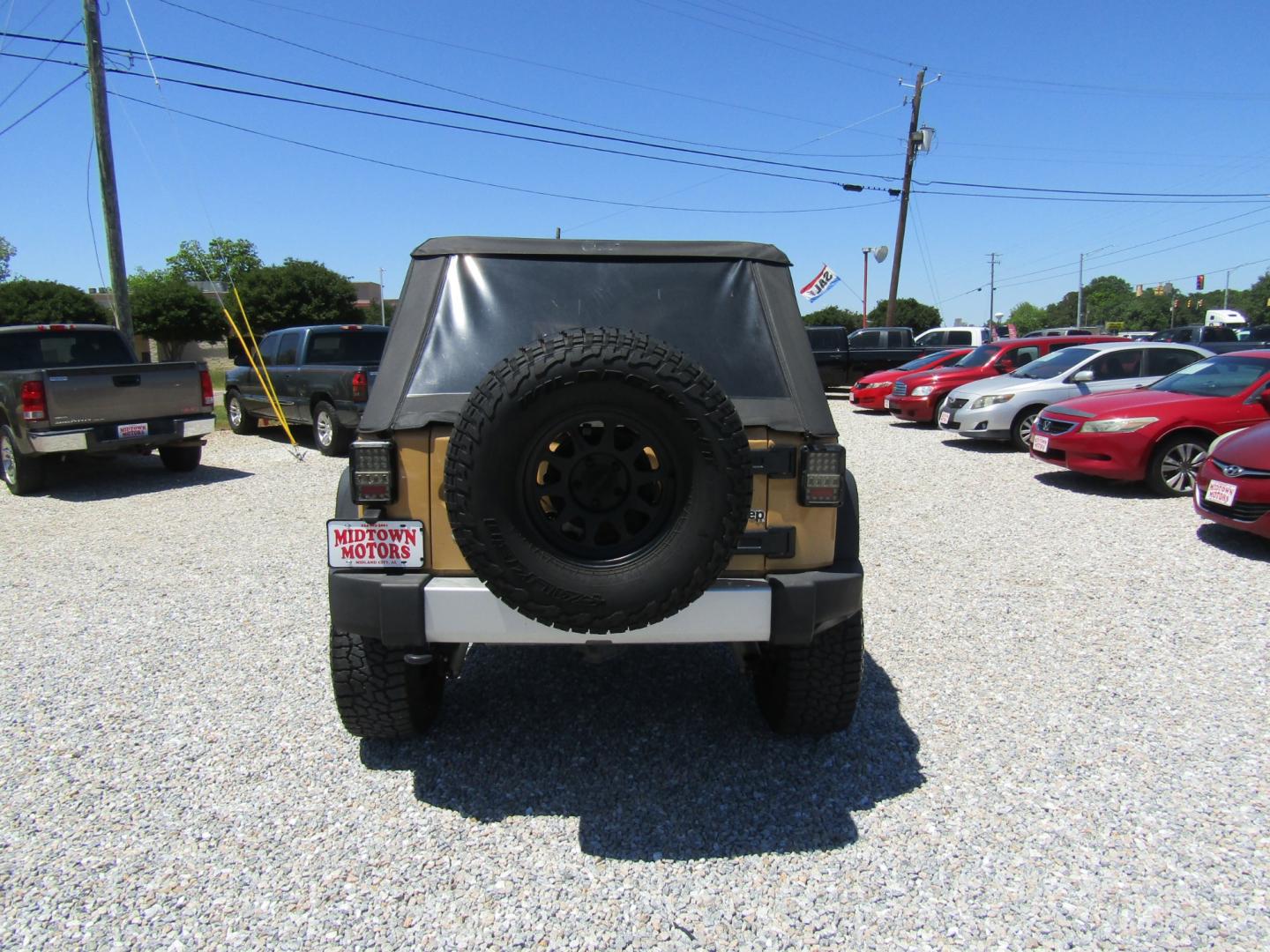 2013 Tan /Black Jeep Wrangler Unlimited Sahara 4WD (1C4HJWEG7DL) with an 3.6L V6 DOHC 24V FFV engine, Automatic transmission, located at 15016 S Hwy 231, Midland City, AL, 36350, (334) 983-3001, 31.306210, -85.495277 - Photo#6